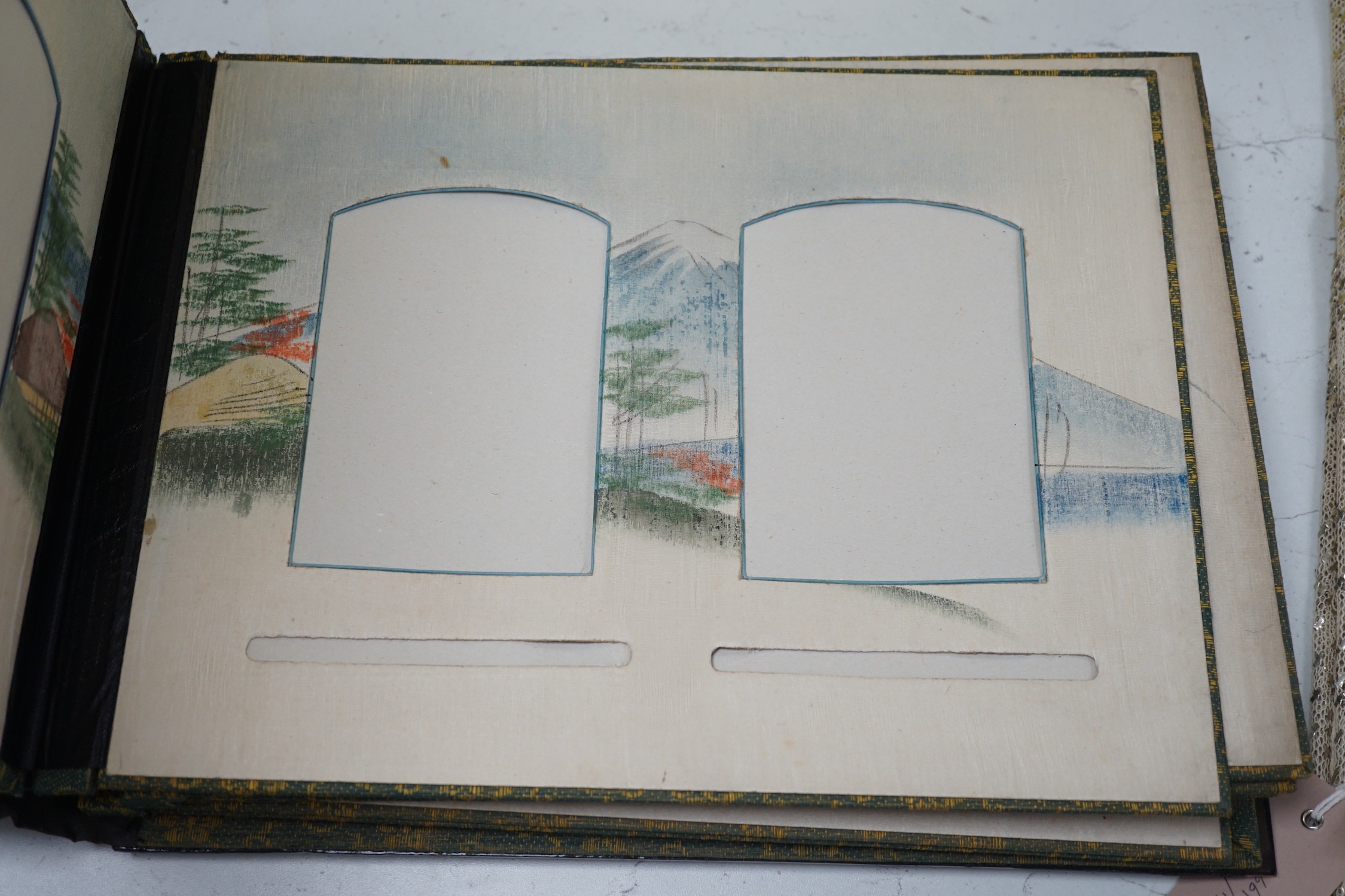 A Japanese shibayama style photograph album, vacant, 35cms wide x 27cms high